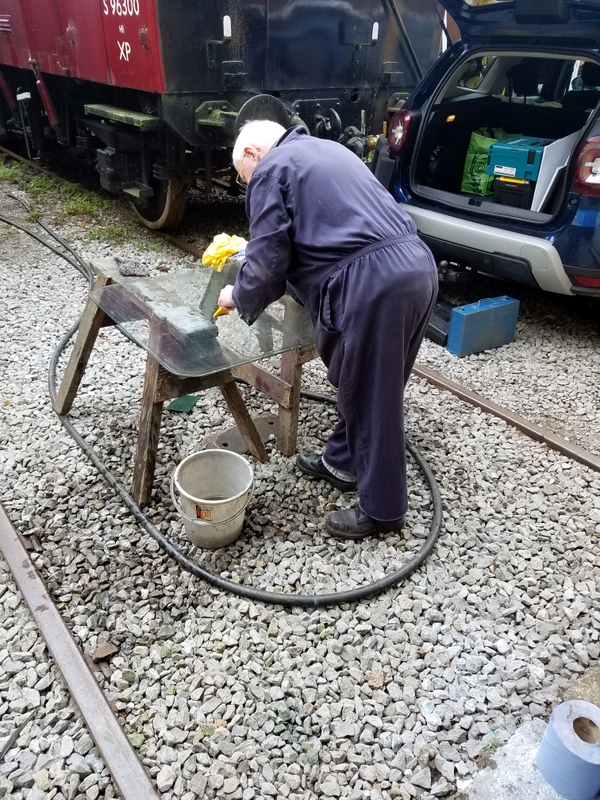 Class 127 Cleaning a window that had been removed from the vehicle