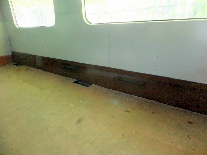 Class 105: Timber beading between the wall panels and the metal upstand