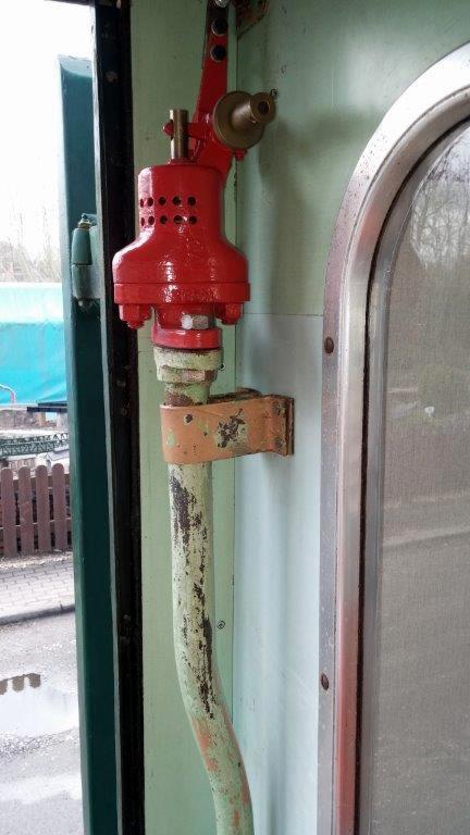 Class 100: Passcom valve with the metal clamps that secure it to the wall