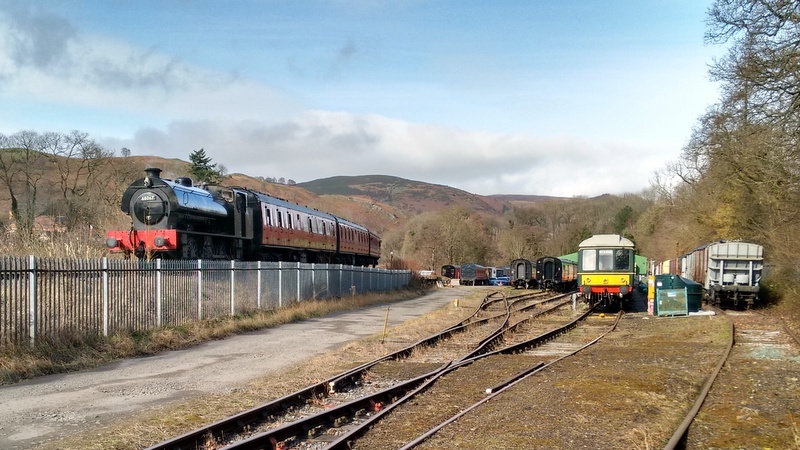 Steam-hauled Berwyn Shuttle passing Pentrefelin Yard