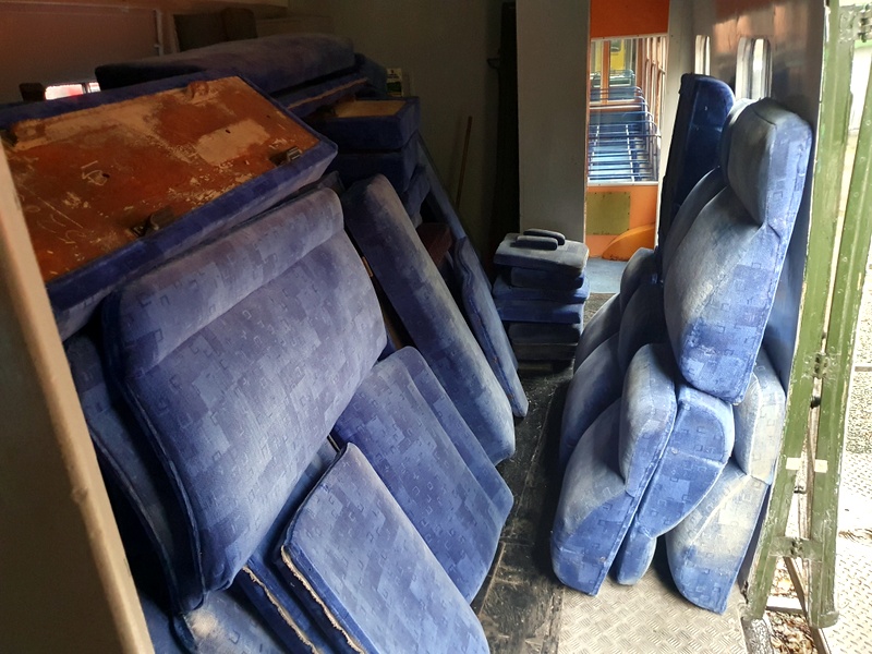Class 108: Worn seat covers stacked in guard's compartment