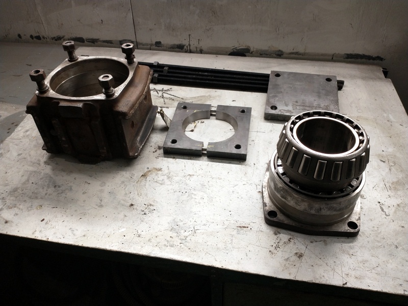 Class 104: Axlebox, roller bearings and components of the puller used to remove the inner bearing
