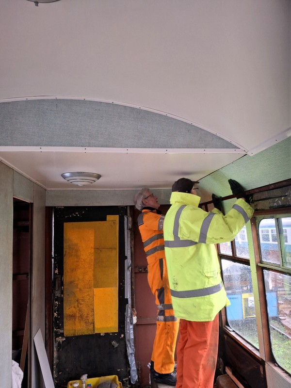 Class 100: Installing the last wall panel above the luggage rack