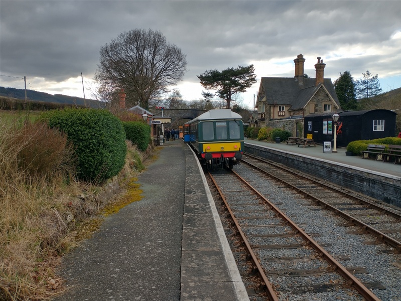 Class 108: Waiting to be passed by a steam-hauled wedding charter at Carrog on 15/03/25
