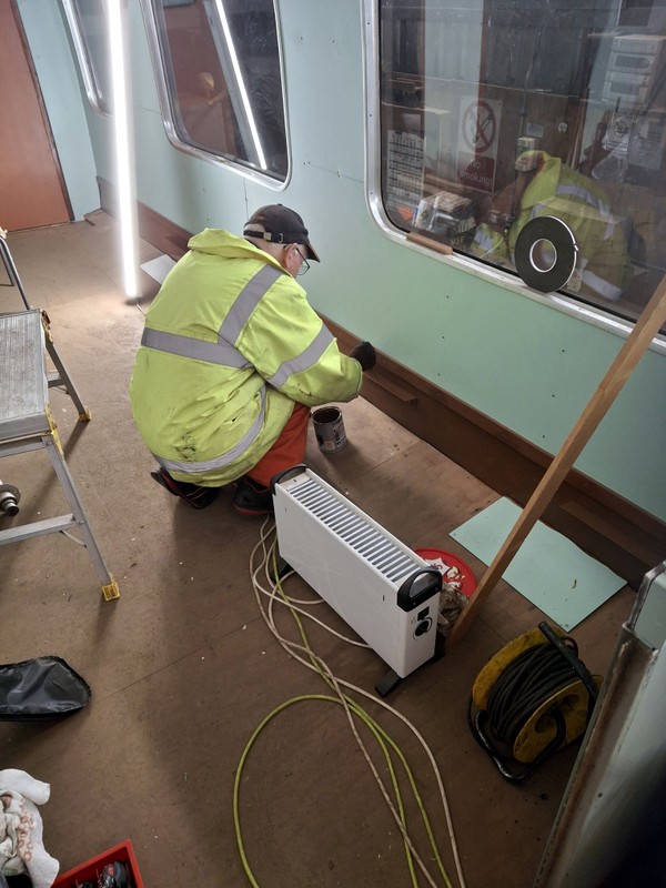 Class 105: Applying a final coat of brown paint to the lower wall section
