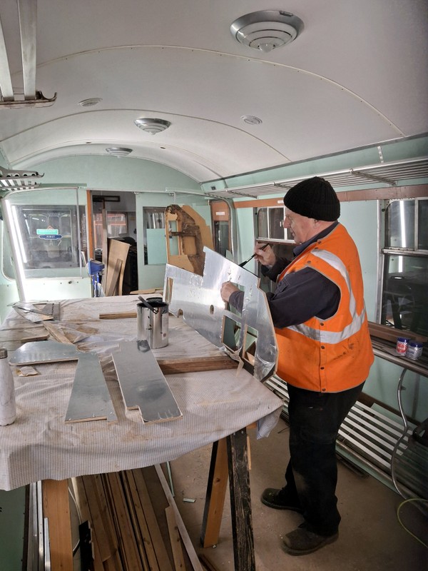 Class 109: Painting the edges of the new driver's desk for the cab of 50416