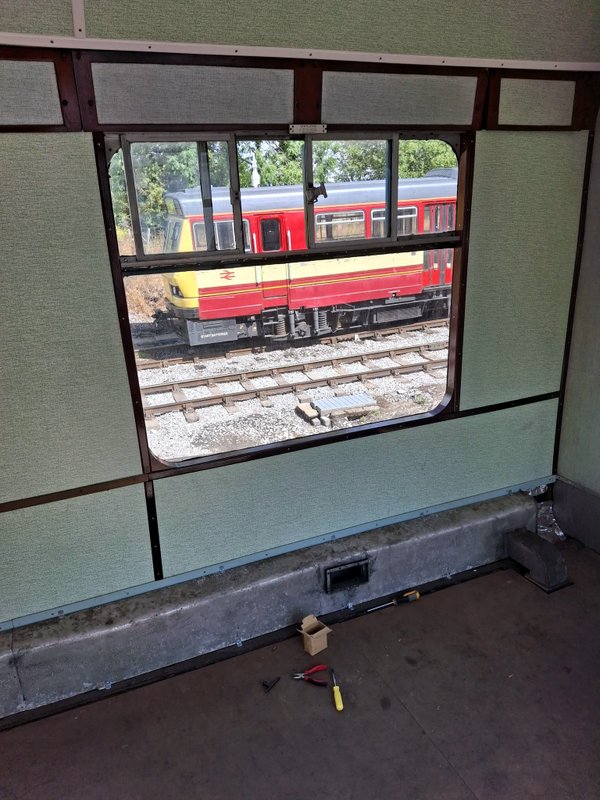 Class 100: Wooden surrounds fitted to a window in 56097