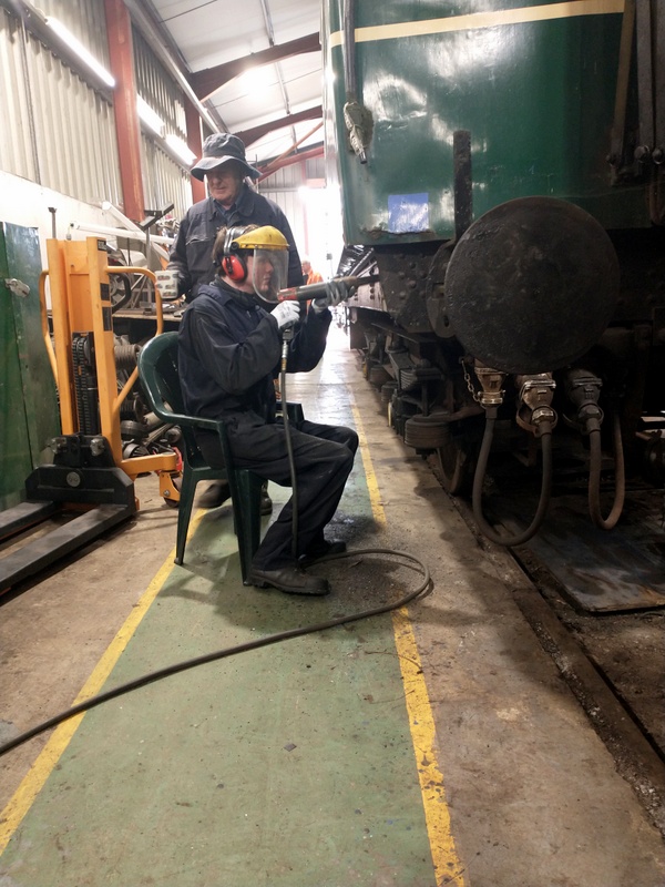 Class 127/108: Needle-gunning the solebar of 56223