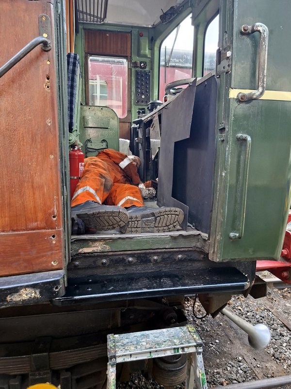 Class 110: Making brake valve adjustments under the desk of 51842