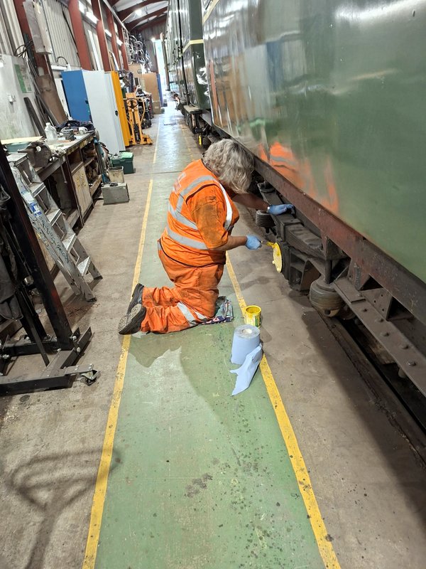 Class 110: Painting yellow gloss on the axlebox covers